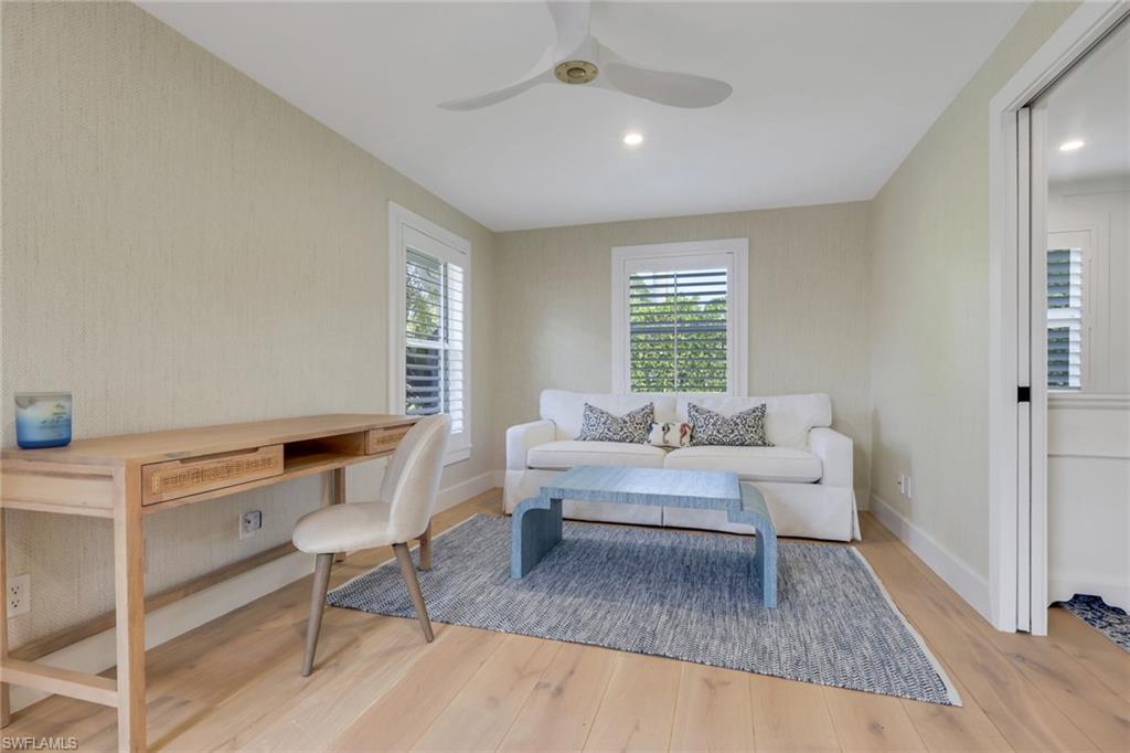 695 Regatta Road Naples, FL 34103 - Photo 20 of 43 Office space featuring light wood-style floors, a ceiling fan, and wallpapered walls