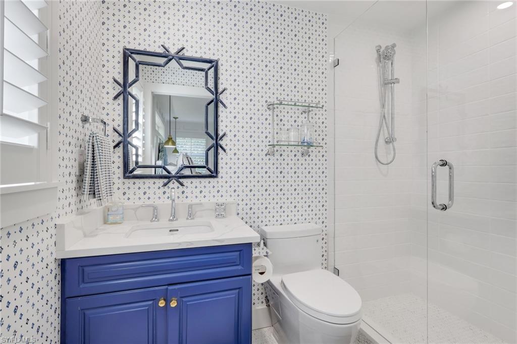 695 Regatta Road Naples, FL 34103 - Photo 23 of 43 Full bath with vanity and a stall shower