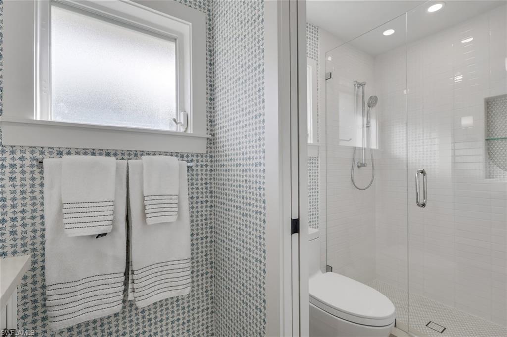 695 Regatta Road Naples, FL 34103 - Photo 26 of 43 Full bath featuring a shower stall and recessed lighting