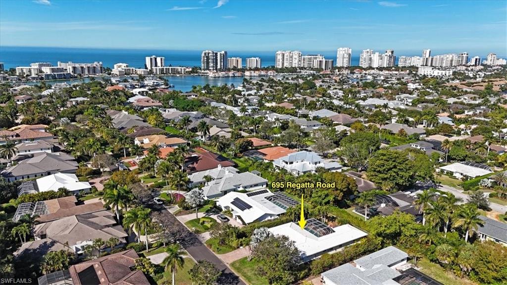 695 Regatta Road Naples, FL 34103 - Photo 3 of 43 Aerial overview of property's location featuring nearby urban area and a large body of water