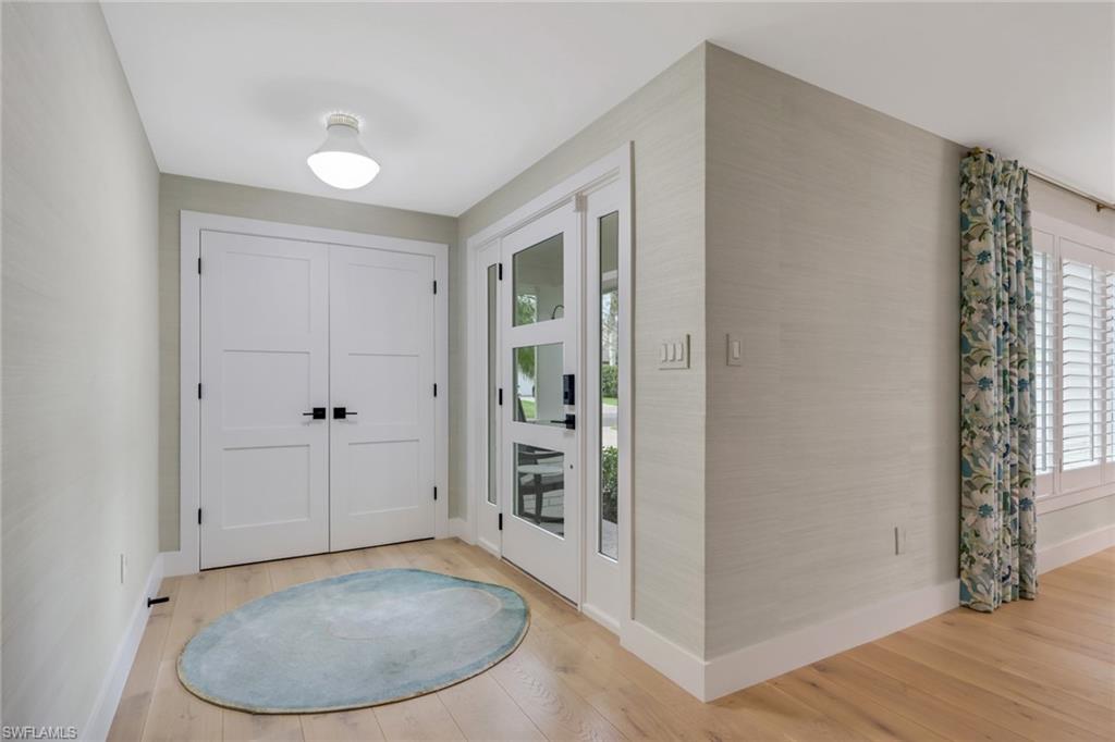 695 Regatta Road Naples, FL 34103 - Photo 4 of 43 Entryway with light wood finished floors