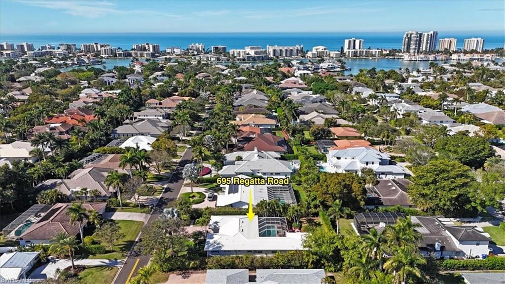 695 Regatta Road Naples, FL 34103 - Photo 40 of 43 Aerial overview of property's location with nearby urban area and a nearby body of water