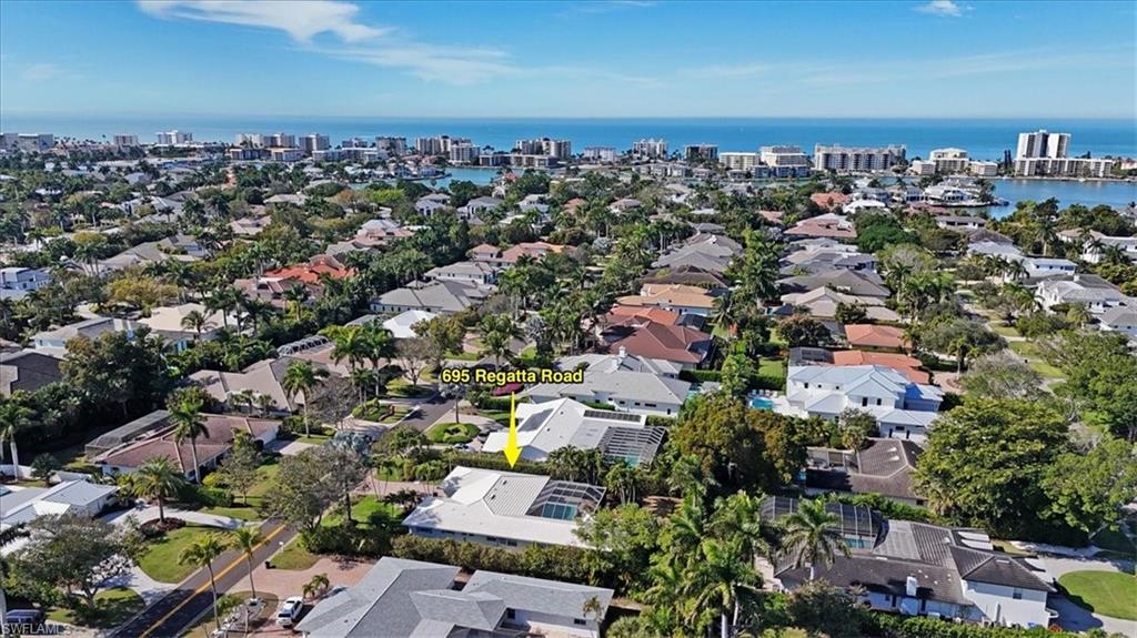 695 Regatta Road Naples, FL 34103 - Photo 42 of 43 Aerial view of property's location featuring nearby urban area and a large body of water