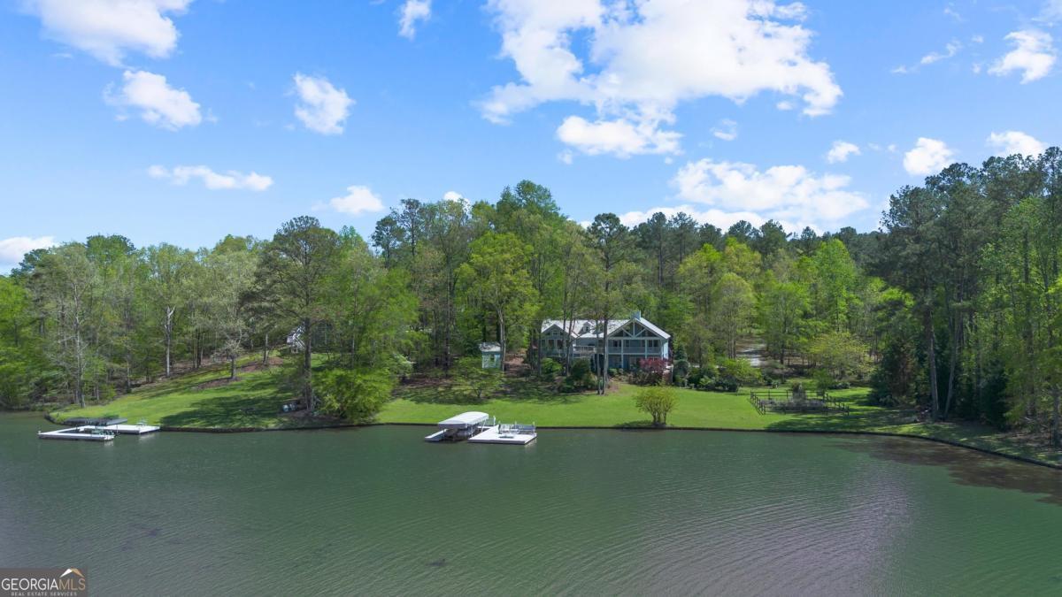 1320 Tal Lewis Road White Plains, GA 30678 - Photo 1 of 7 a view of a golf course with a lake