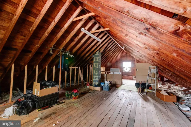 a view of a patio with table and chairs with wooden floor and fence