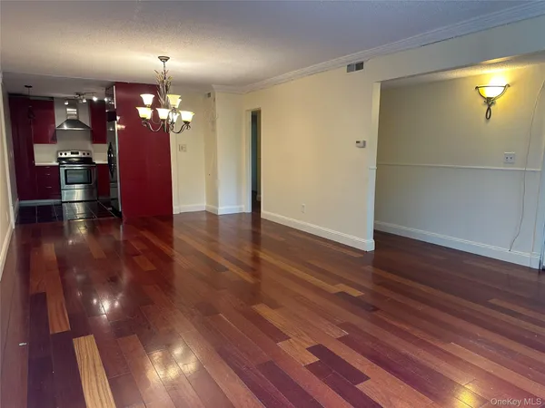 a view of a livingroom with wooden floor