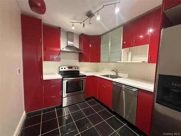 a view of a room with wooden floor fan and window