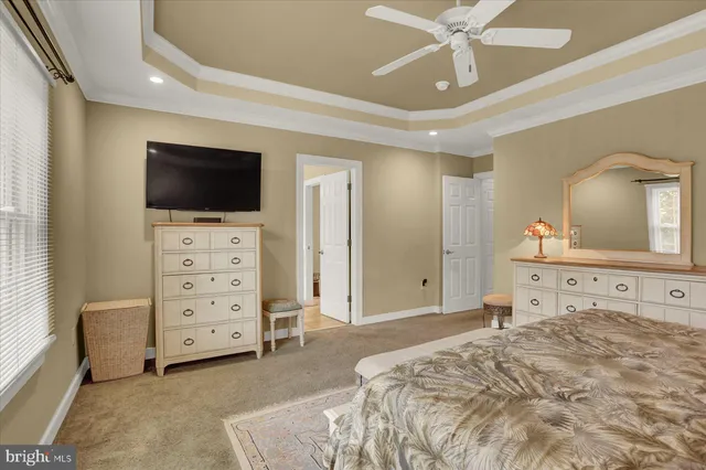 a bathroom with a tub a double vanity sink and a large mirror