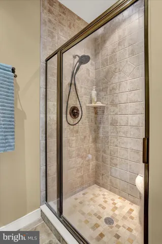 a view of a hallway with wooden floor and entryway