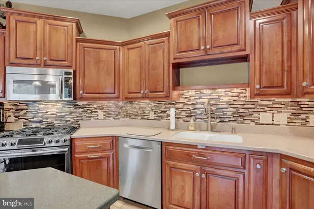 a room with lots of furniture and a chandelier