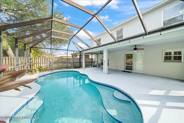 a view of a swimming pool with a patio