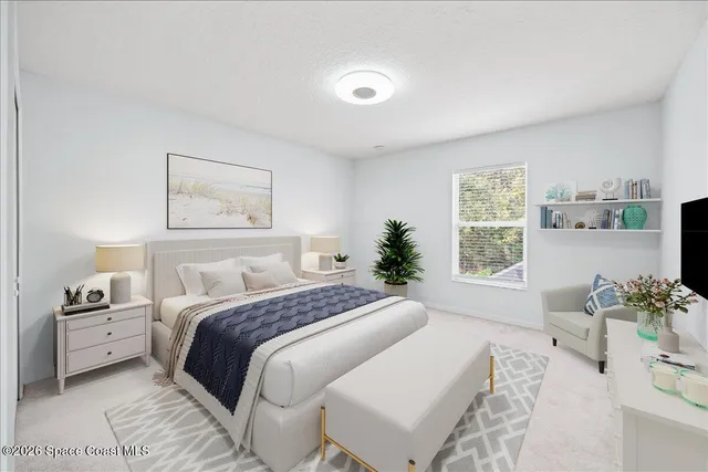 a bedroom with a large bed and a window