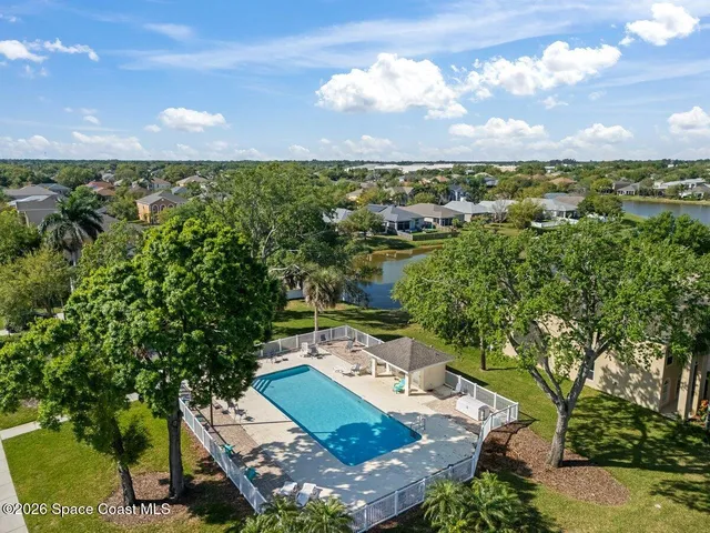 a view of outdoor space with swimming pool and outdoor seating