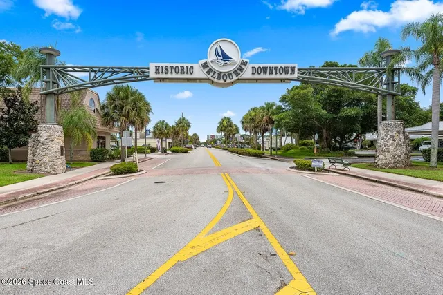 a view of swimming pool with outdoor seating and lake view