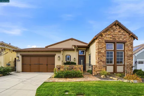 a living room with furniture and large windows