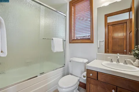 a bathroom with a tub and shower