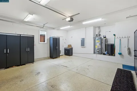 a view of backyard with swimming pool and green space