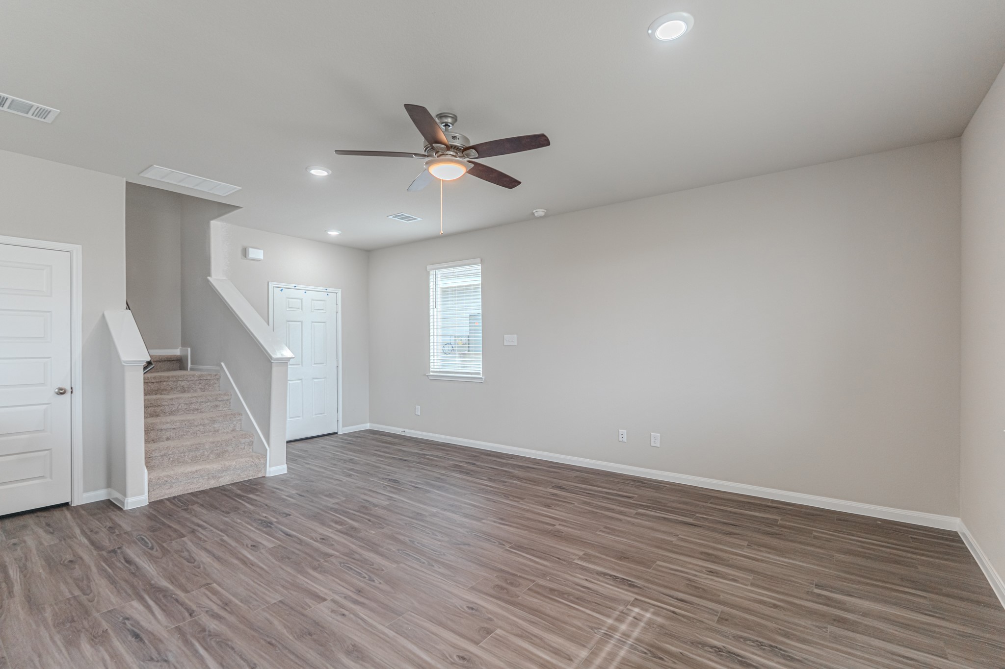 9219 Grace Rdg Drive Willis, TX 77318 - Photo 13 of 44 wooden floor in an empty room with a window