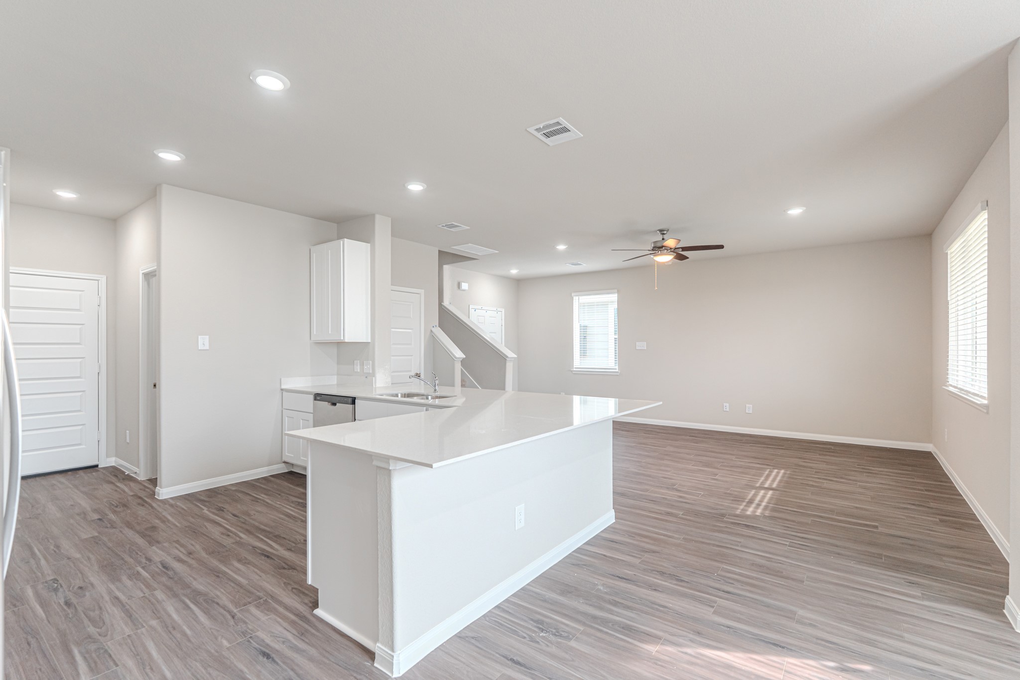 9219 Grace Rdg Drive Willis, TX 77318 - Photo 19 of 44 a large kitchen with stainless steel appliances a large counter top a sink and a refrigerator