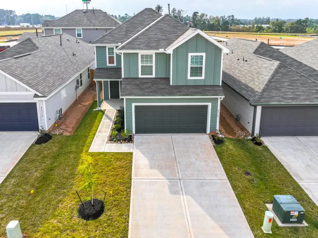 a aerial view of a house with a yard