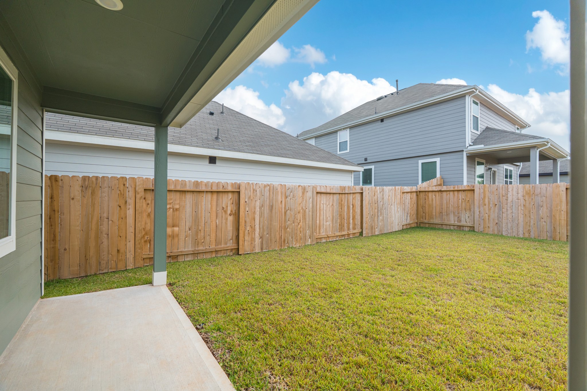 9219 Grace Rdg Drive Willis, TX 77318 - Photo 41 of 44 a view of a yard with wooden fence