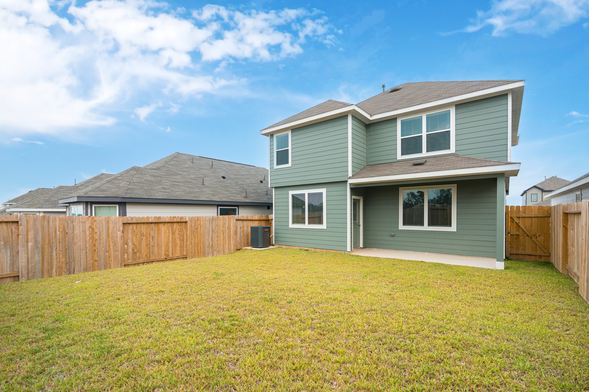 9219 Grace Rdg Drive Willis, TX 77318 - Photo 42 of 44 a front view of a house with yard and garage