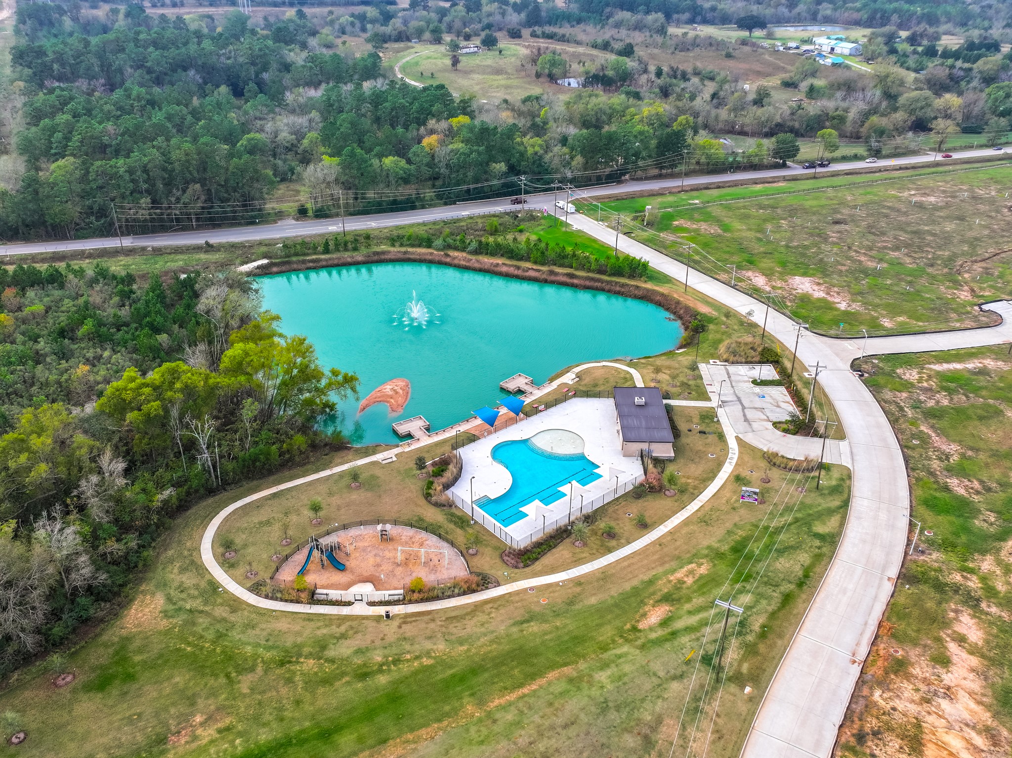 9219 Grace Rdg Drive Willis, TX 77318 - Photo 6 of 44 a view of a swimming pool with a yard and seating