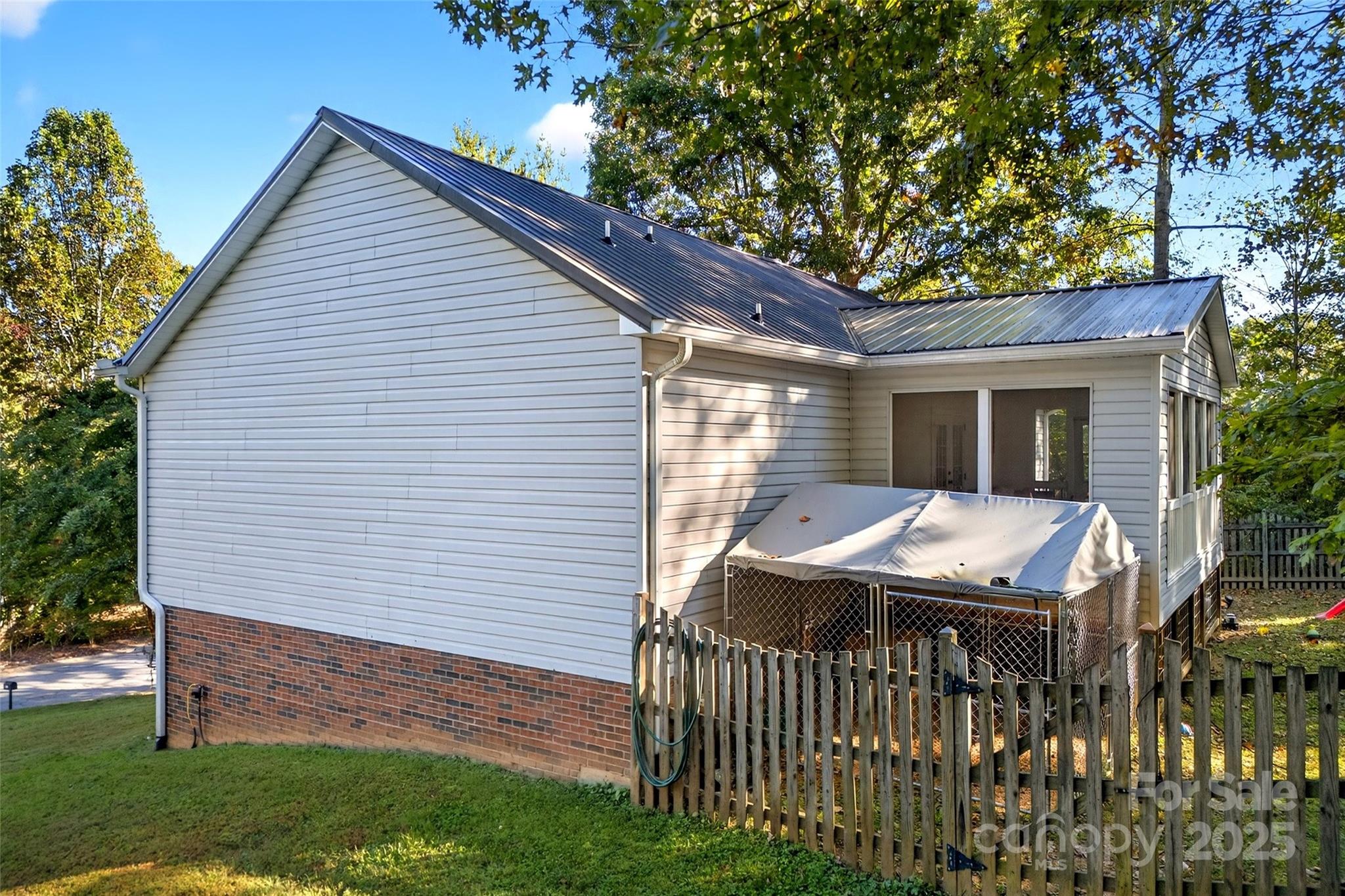 2691 Laurel Point Drive Nebo, NC 28761 - Photo 41 of 44 a side view of a house with a porch