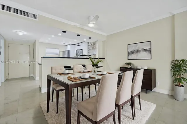 a view of a dining room with furniture and table
