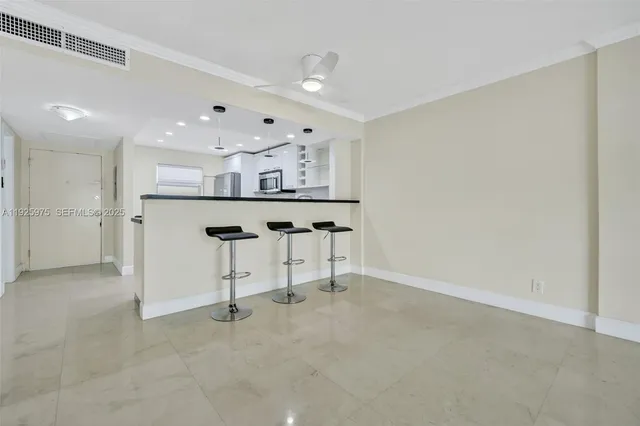 a view of kitchen with refrigerator sink and wooden floor