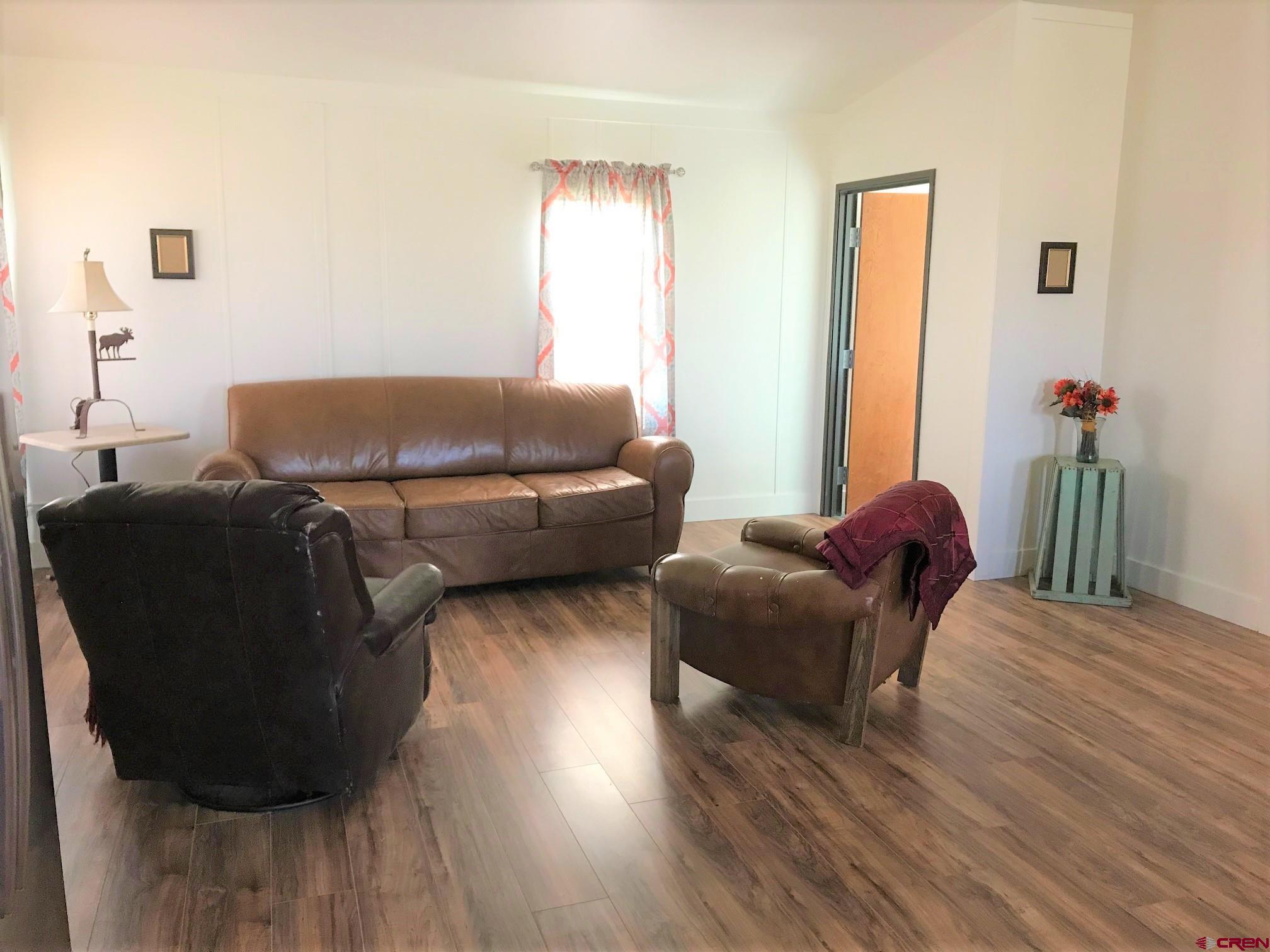 5123 Flint Delta, CO 81416 - Photo 18 of 24 a living room with furniture and a wooden floor