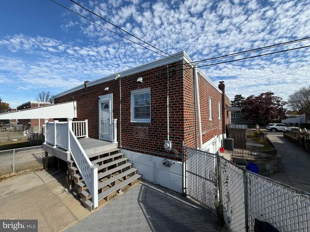 a view of a backyard with sitting area