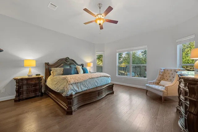 a bedroom with a bed and a couch