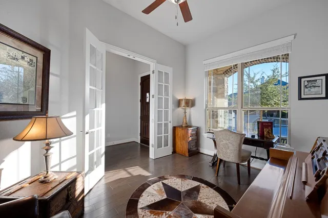 a living room with furniture and a lamp