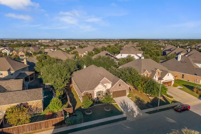 an aerial view of a houses with a outdoor space