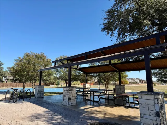 a view of a chairs and table in the patio