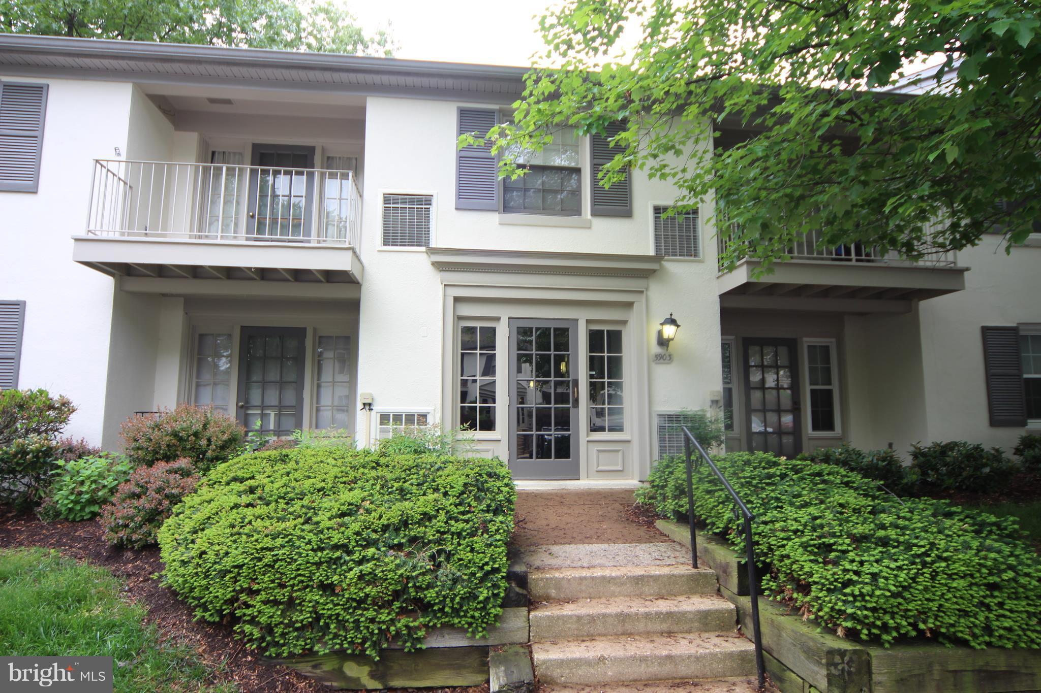5903 Kingsford Road, Unit H Springfield, VA 22152 - Photo 1 of 18 front view of a house with potted plants