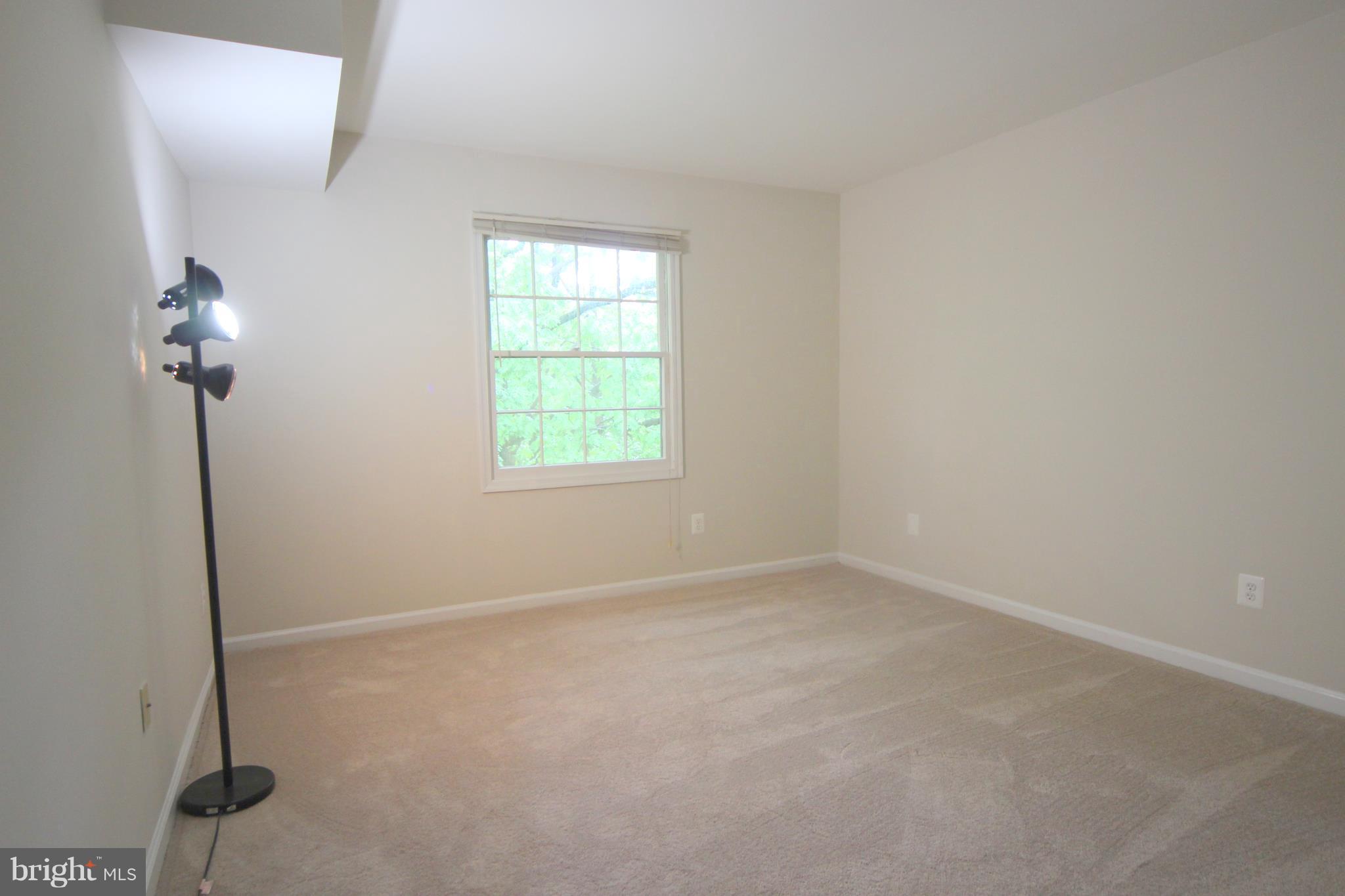 5903 Kingsford Road, Unit H Springfield, VA 22152 - Photo 8 of 18 a view of an empty room with a window