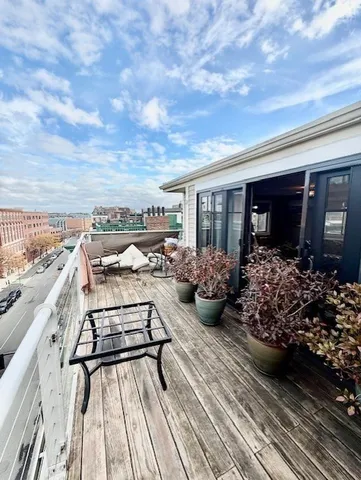 a view of a chairs and table on the terrace