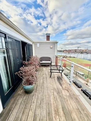 a view of roof deck with patio