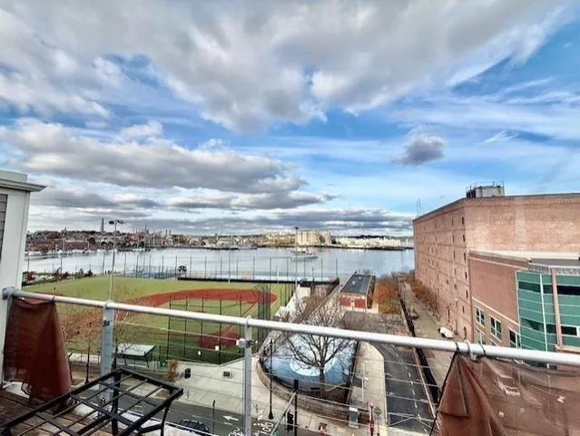 a view of a city with lawn chairs
