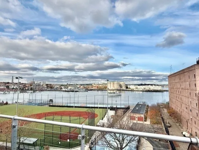 a view of a swimming pool with a table and chairs