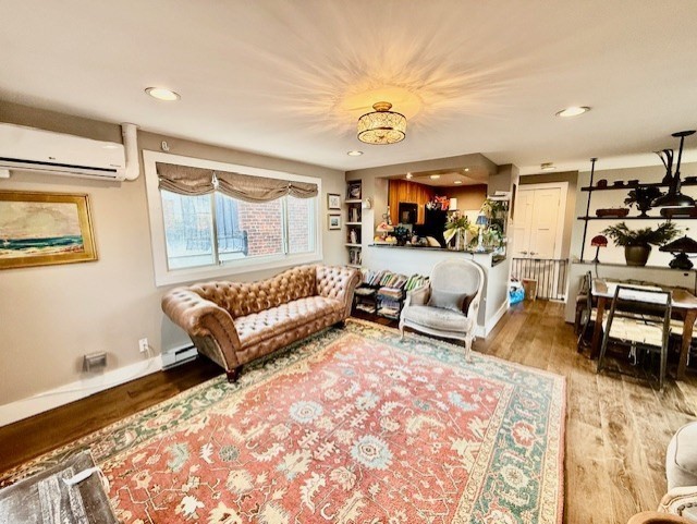 480 Commercial Street, Unit 5A Boston, MA 02109 - Photo 3 of 41 a living room with furniture and a large window