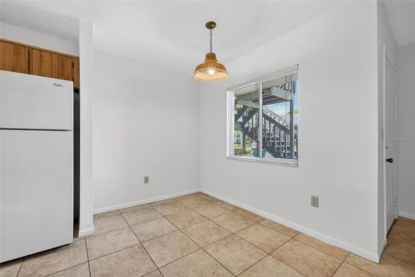 a view of an empty room with windows