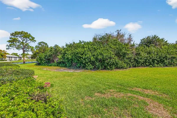 a view of a golf course with a lake