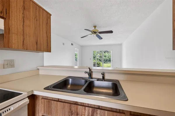 a kitchen with a sink and a window