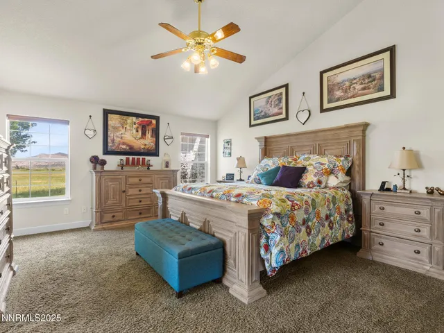 a bedroom with a bed and a fireplace