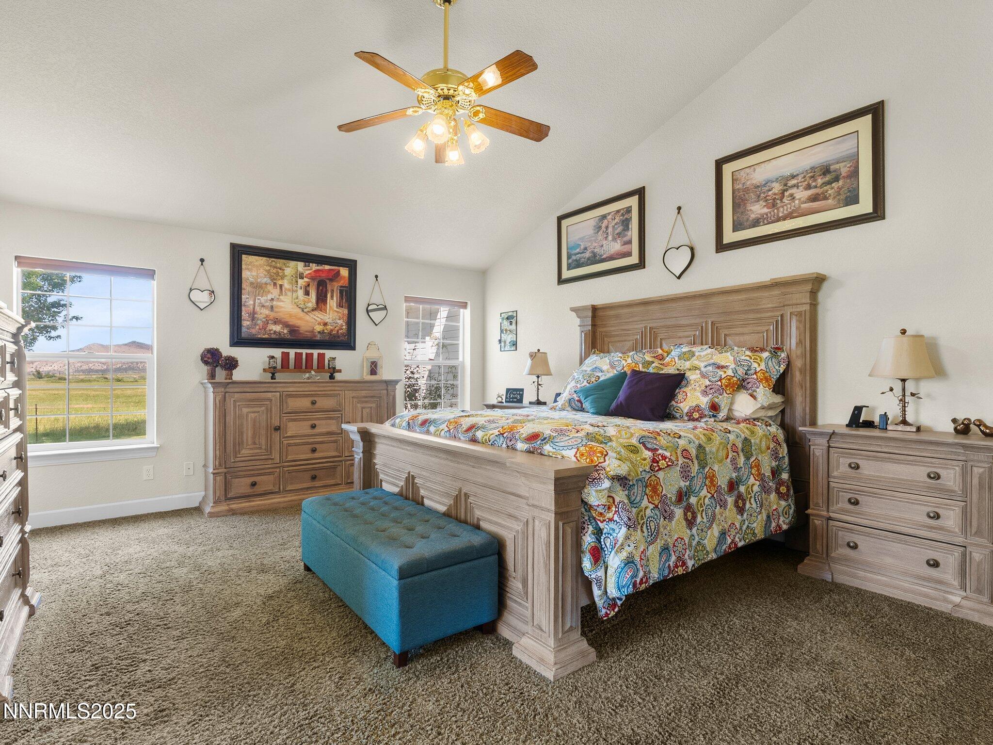 801 Larson Lane Coleville, CA 96107 - Photo 15 of 37 a bedroom with a bed a couch and paintings on the wall