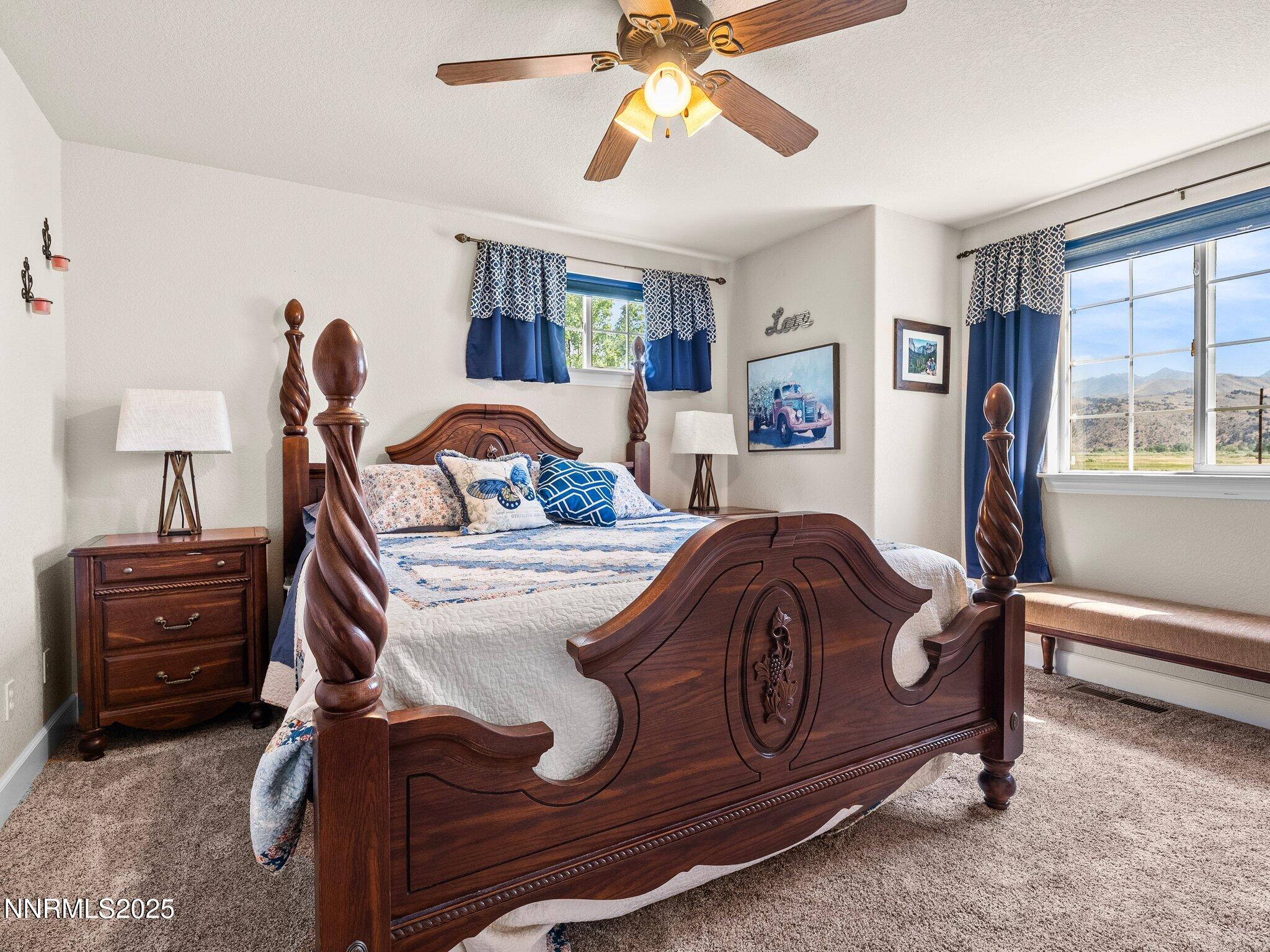 801 Larson Lane Coleville, CA 96107 - Photo 22 of 37 a bedroom with a bed and a chandelier