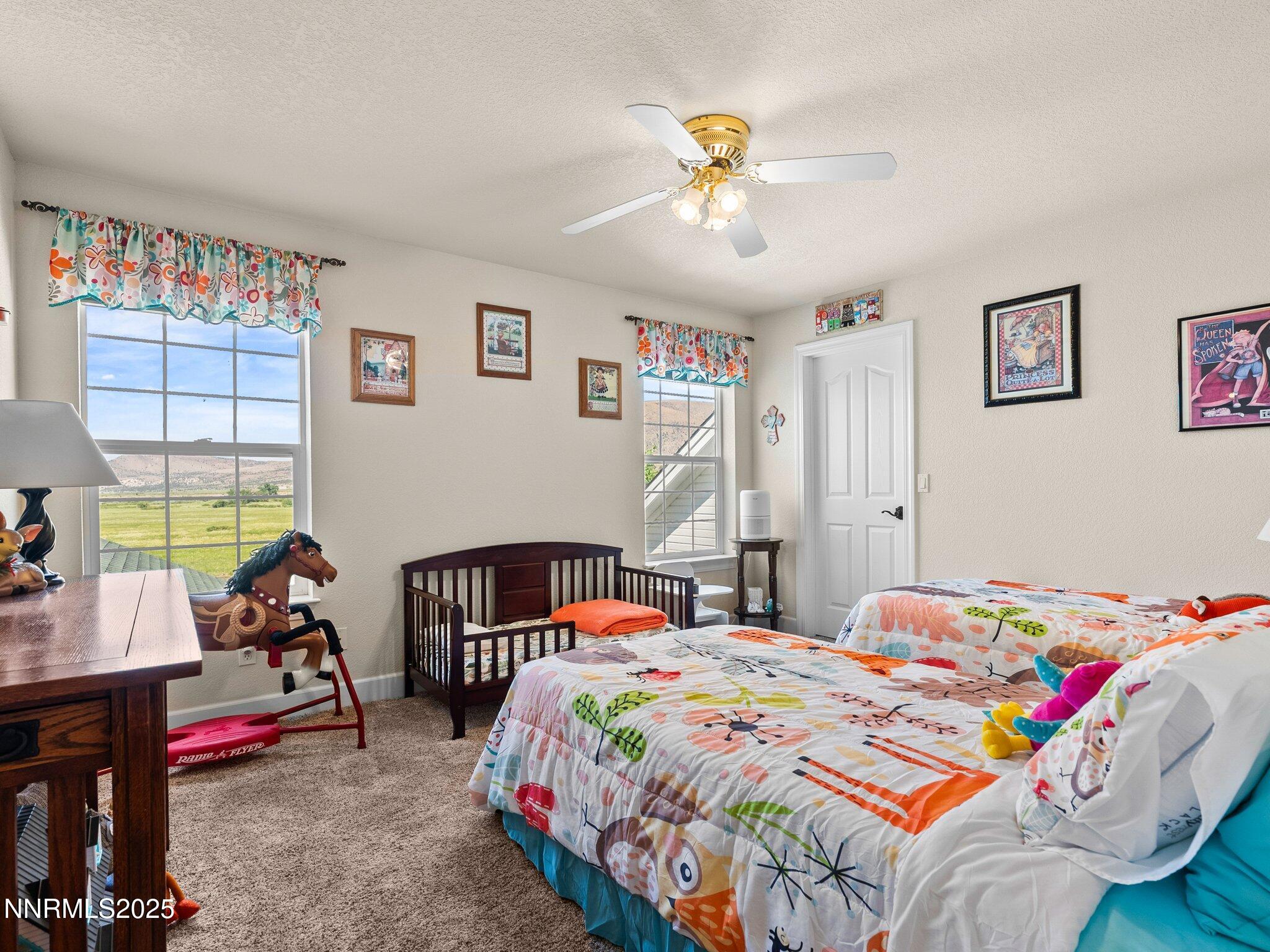 801 Larson Lane Coleville, CA 96107 - Photo 23 of 37 a bedroom that has a bed and a chandelier